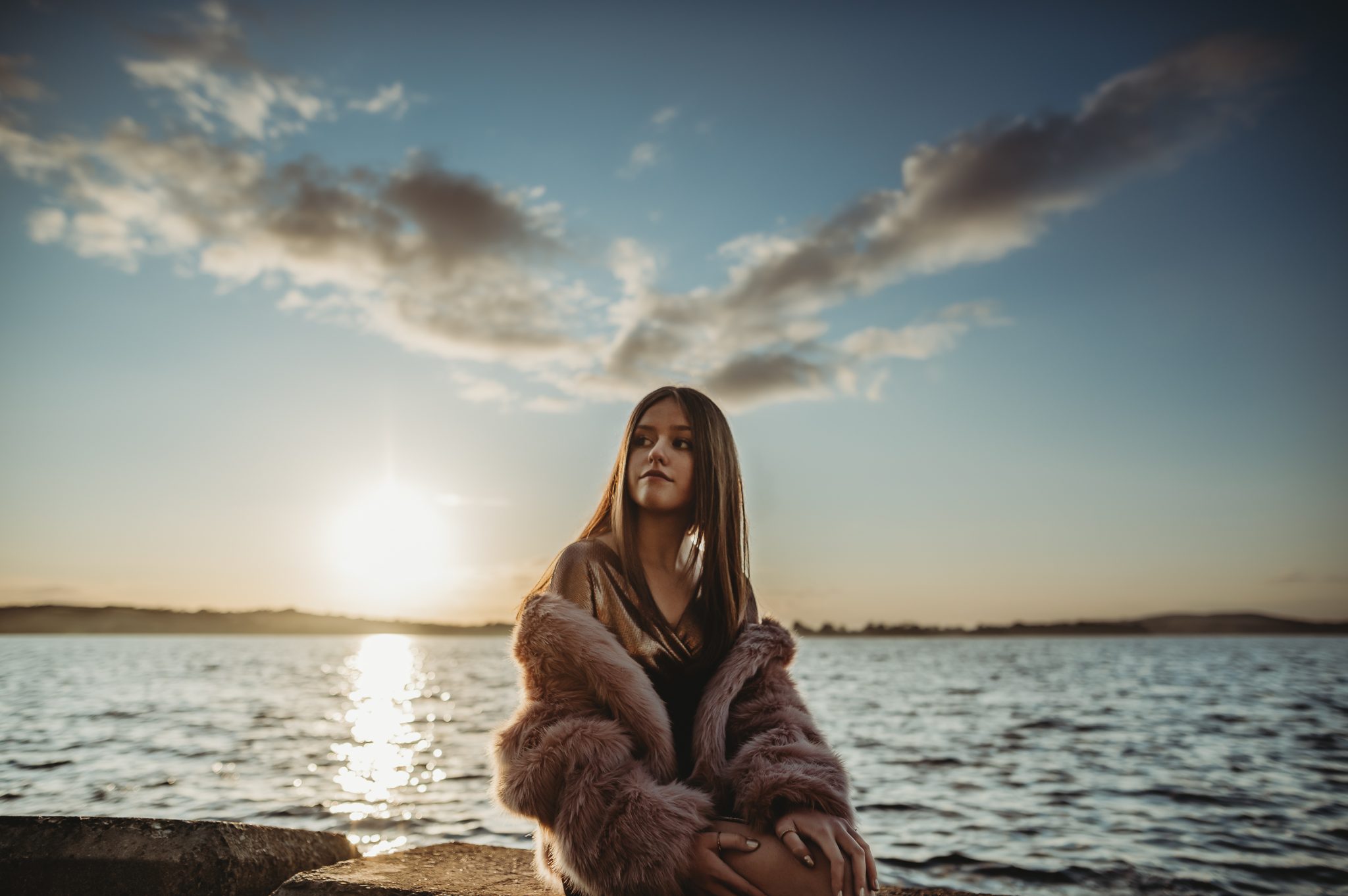 Personal-branding-photography-young-woman-with-stunning-sky-in-the-background